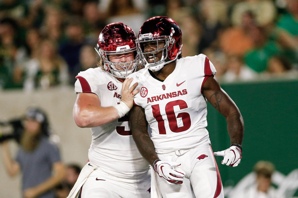 Sep 8, 2018; Fort Collins, CO, USA; Arkansas Razorbacks wide receiver La’Michael Pettway (16) celebrates with offensive lineman Hjalte Froholdt (51) after a touchdown in the third quarter against the Colorado State Rams at Canvas Stadium. Mandatory Credit: Isaiah J. Downing-USA TODAY Sports