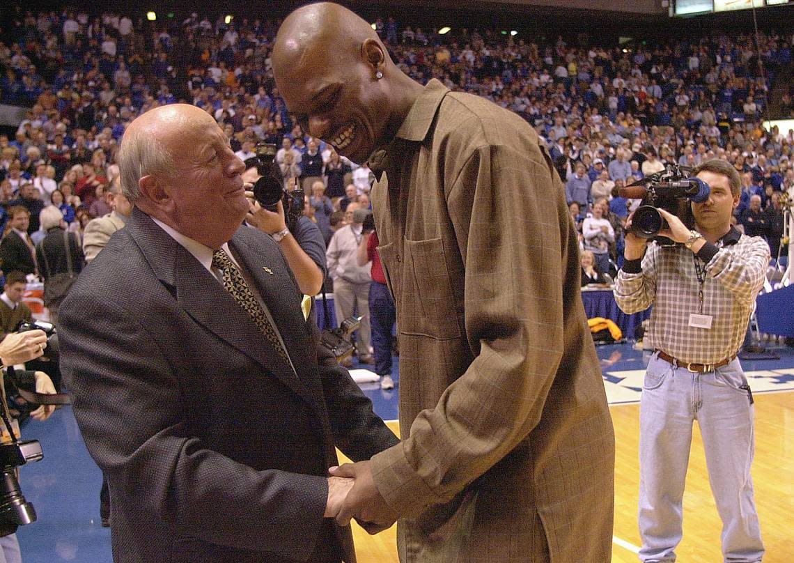 Jamal Mashburn gets congratulations from Bill Keightley after both had banners raised in Rupp Arena during a Kentucky game in 2000.