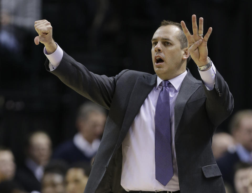 Indiana Pacers head coach Frank Vogel calls a play to his team in the second half of an NBA basketball game against the Denver Nuggets in Indianapolis, Monday, Feb. 10, 2014. The Pacers won 119-80. (AP Photo/Michael Conroy)