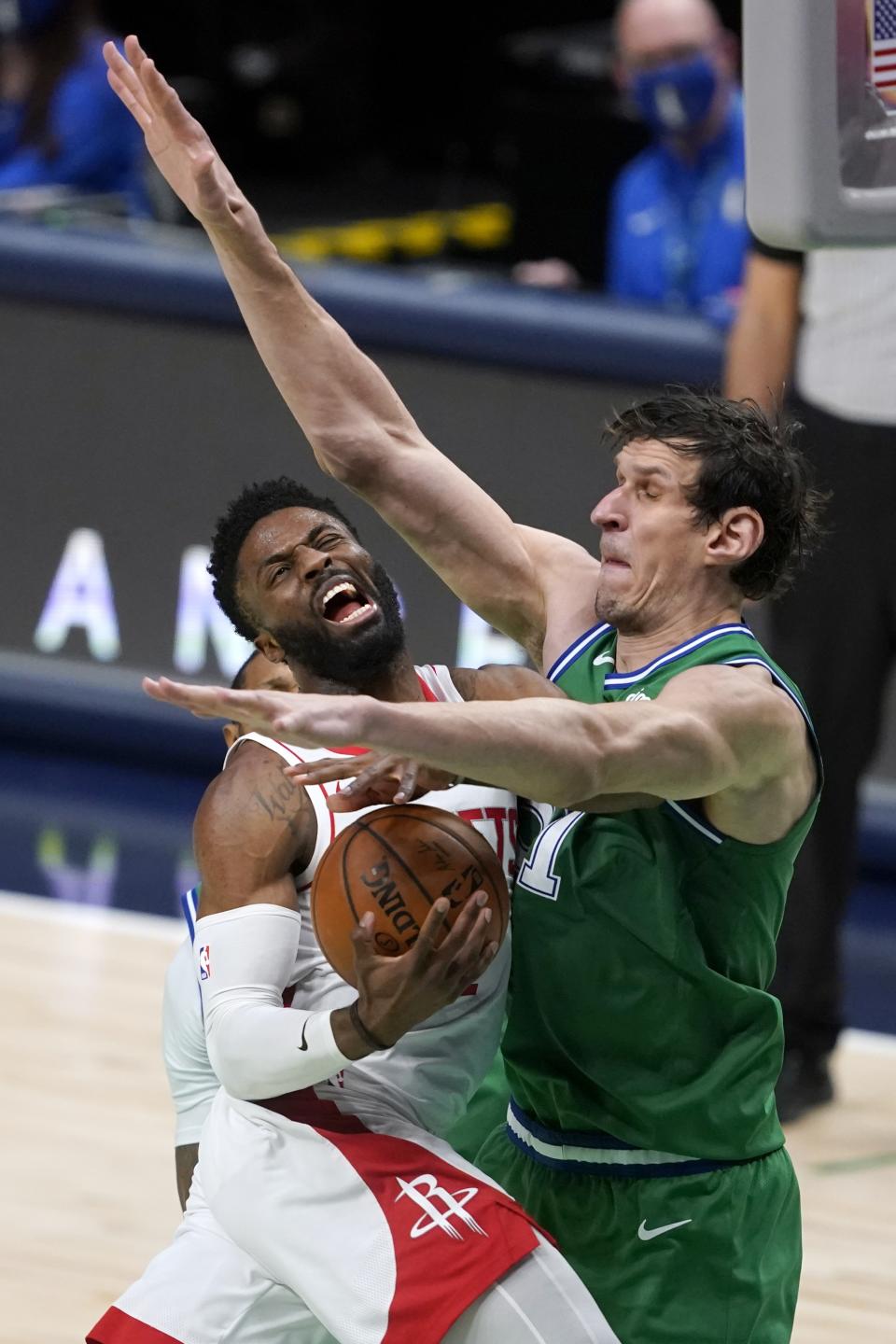 Houston Rockets guard David Nwaba (2) is unable to reach the basket for a shot as Dallas Mavericks' Boban Marjanovic (51) defends during the second half of an NBA basketball game in Dallas, Saturday, Jan. 23, 2021. (AP Photo/Tony Gutierrez)