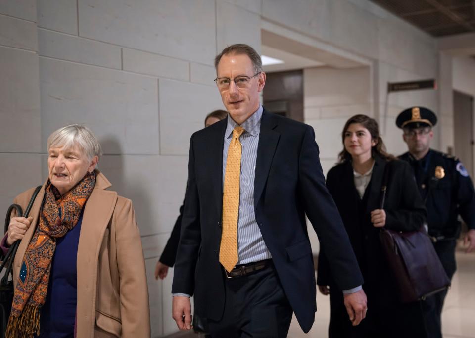 Mark Sandy, a career employee in the White House Office of Management and Budget, arrives at the Capitol to testify in the House Democrats' impeachment inquiry about President Donald Trump's effort to tie military aid for Ukraine to investigations of his political opponents, in Washington, Saturday, Nov. 16, 2019.