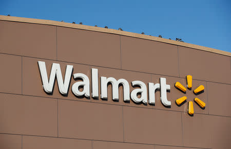 FILE PHOTO: Walmart's logo is seen outside one of the stores in Chicago, Illinois, U.S., November 20, 2018. REUTERS/Kamil Krzaczynski