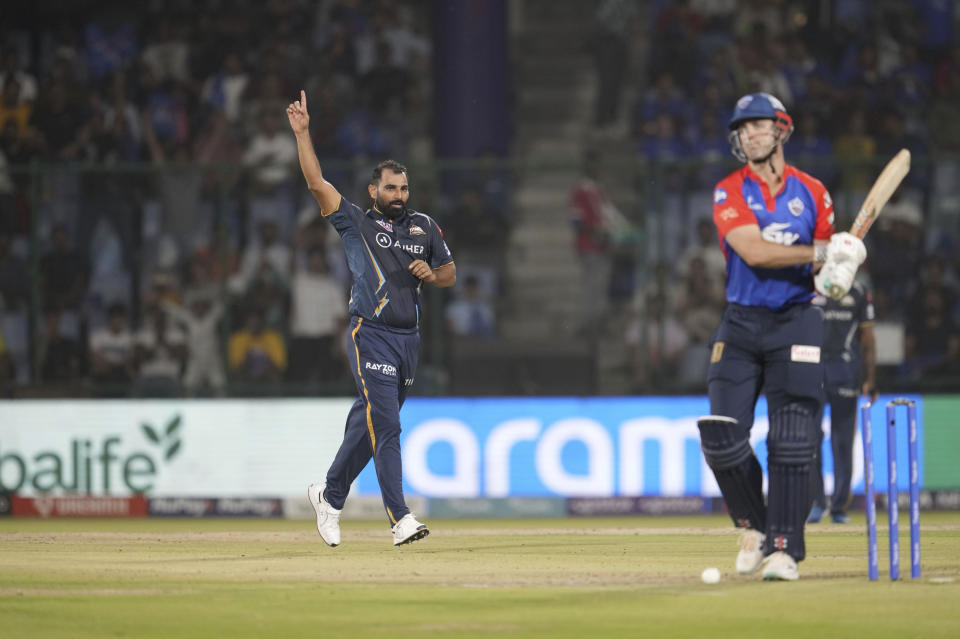 Gujarat Titans' Mohammed Shami celebrates the dismissal of Delhi Capital's Mitchell Marsh during the Indian Premier League (IPL) cricket match between Delhi Capitals and Gujarat Titans in New Delhi, India, Tuesday, April 4, 2023. (AP Photo/Manish Swarup)