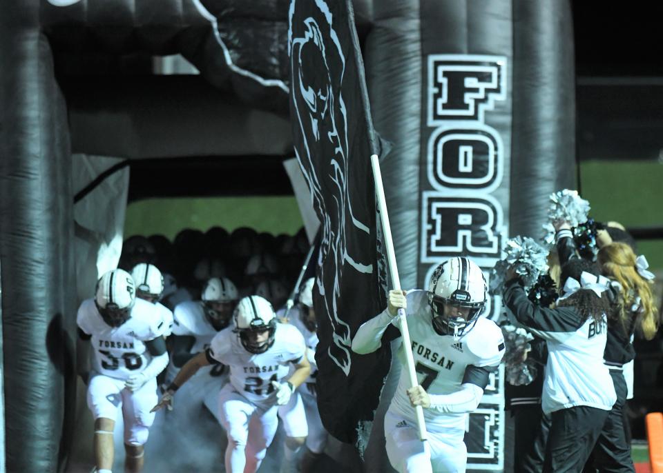 Forsan's Major Stockton leads the team onto the field before a Class 2A Division I area playoff against New Deal on Thursday, Nov. 18, 2021, at Wolf Stadium in Colorado City.