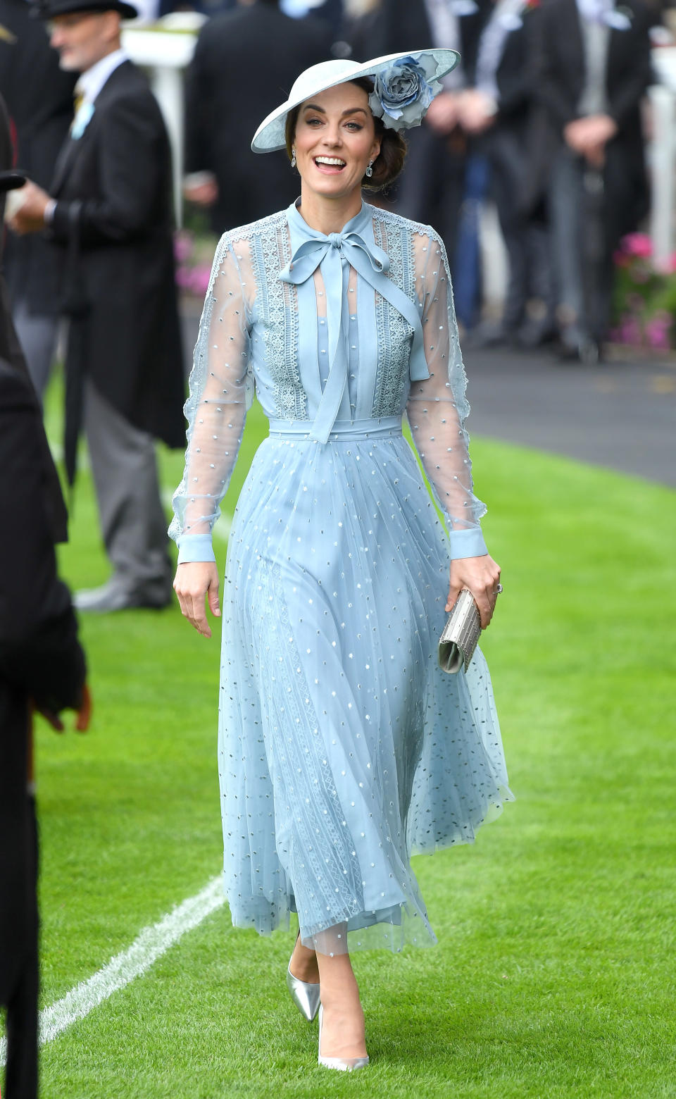 The Duchess of Cambridge wore a custom Elie Saab skirt and blouse combo retailing for AU$6,600, with a saucer-style hat by milliner Philip Treacy. Photo: Getty