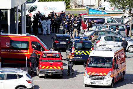 A general view shows rescue forces and police officers at a supermarket after a hostage situation in Trebes, France, March 23, 2018. REUTERS/Regis Duvignau