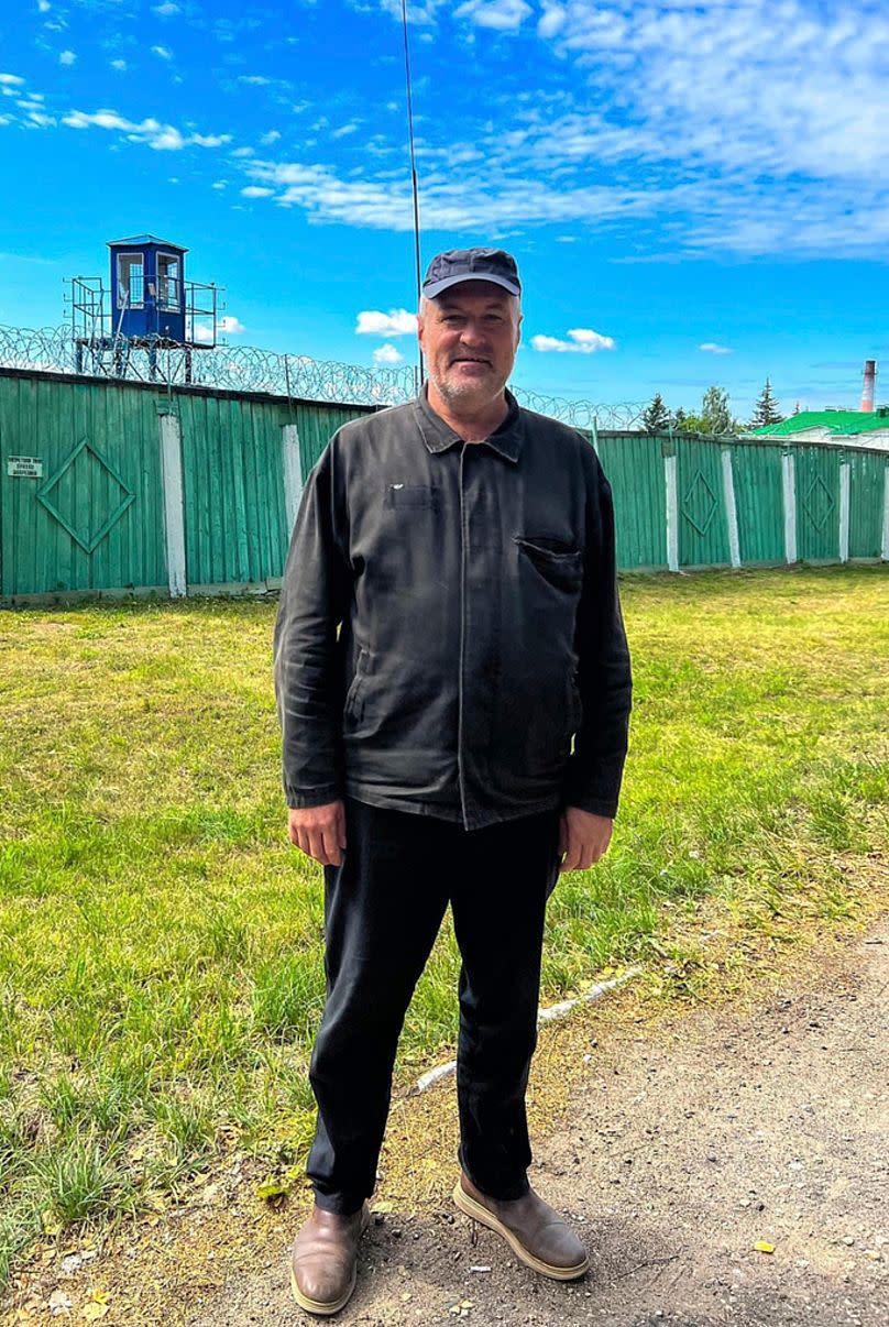 Leanid Sudalenka stands outside a penal colony after his release in Vitba, Belarus in July