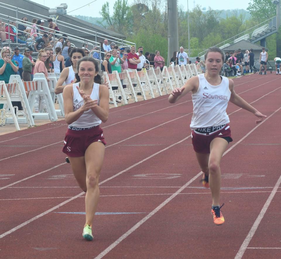 Southside's Abbie Owens (left) claps as she wins the 100-meter dash at the Etowah County schools track and field meet on Wednesday, April 13, 2022 in Gadsden, Alabama. Ehsan Kassim/Gadsden Times.