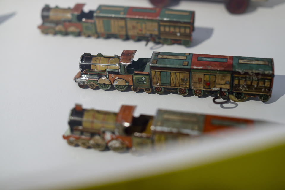 Tin toy trains are displayed at the "Childhood and Peronism, the toys of the Eva Perón Foundation" exhibit at the Evita Museum in Buenos Aires, Argentina Wednesday, April 17, 2019. The set itself was given by Evita personally to Saúl Macyszyn, a boy at the time, who was recovering from an accident that left him quadriplegic and without one of arm. (AP Photo/Natacha Pisarenko)