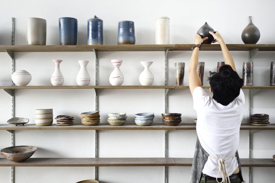 millennial woman in her ceramics shop