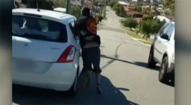 A man thrusts his arm through the window of a car in Scarborough. Source: 7 News