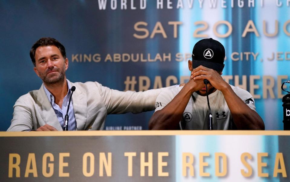 Boxing promoter Eddie Hearn comforts Anthony Joshua during a press conference following defeat in the World Heavyweight Championship WBA Super IBF, IBO and WBO fight against Oleksandr Usyk a - Nick Potts/PA