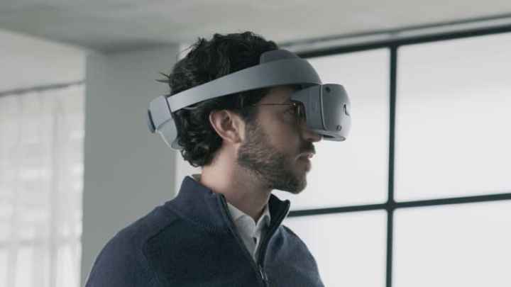 Someone using the Sony mixed-reality headset in front of a window.
