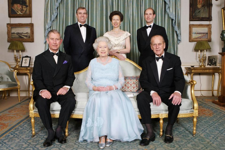 In this file photo taken Nov. 18, 2007, Britain's Queen Elizabeth II (front center) and Prince Philip, Duke of Edinburgh (front right) are joined at Clarence House in London by Prince Charles, (front left) Prince Edward, (back right) Princess Anne (back center) and Prince Andrew (back left) on Nov. 18, 2007.