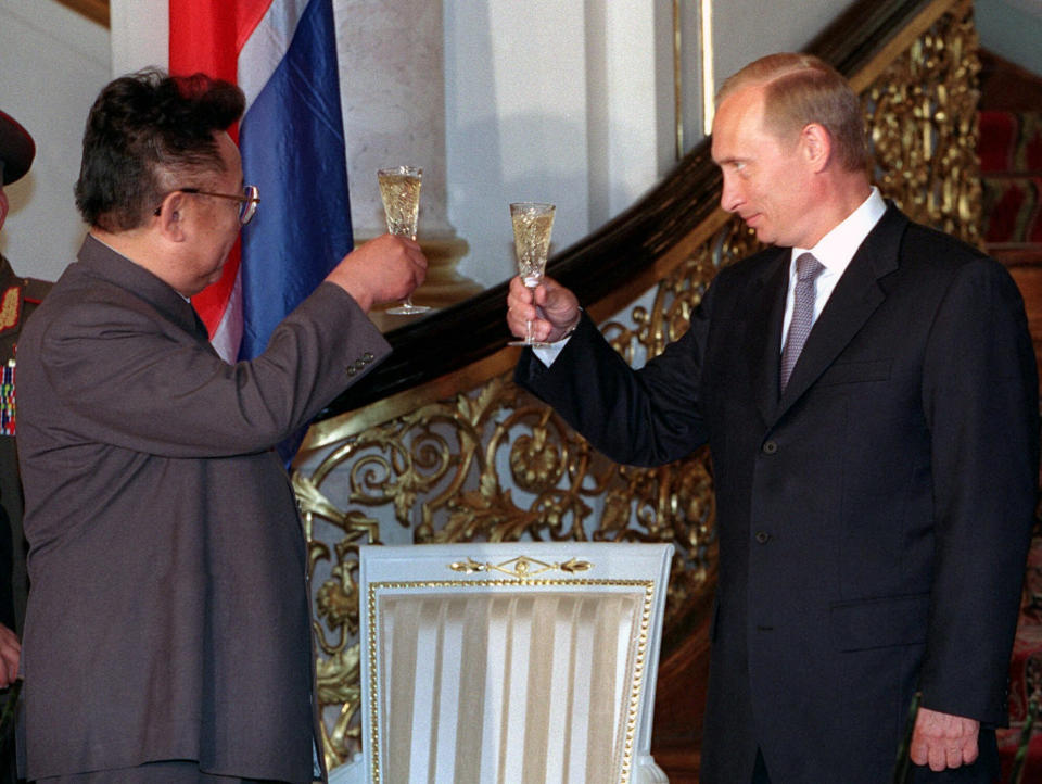 FILE - In this file Saturday, Aug. 4, 2001 file photo, Russian President Vladimir Putin, right, clinks glasses with North Korean leader Kim Jong Il during their meeting at the Kremlin in Moscow, Russia. North Korean leader Kim Jong Un’s summit with Russian President Vladimir Putin this week expands a diplomatic charm offensive that has included meetings with leaders from China, South Korea and the United States.(Vladimir Vyatkin, Sputnik, Kremlin Pool Photo via AP, File)