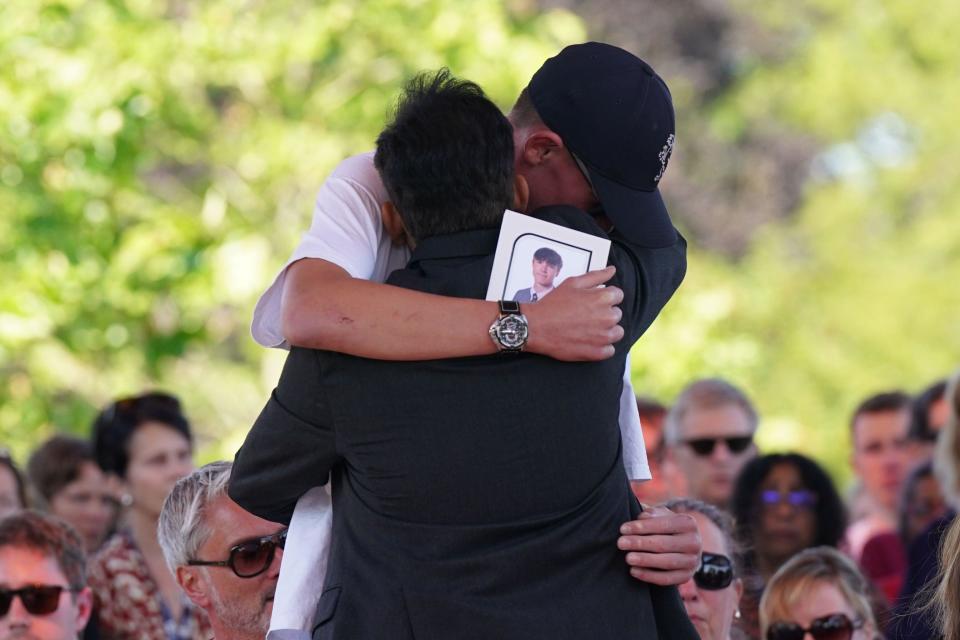 Grace Kumar's father and Barnaby Webber's brother, Charlie, embrace ahead of a vigil at the University of Nottingham after they and Ian Coates were killed and another three hurt in connected attacks on Tuesday morning. Picture date: Wednesday June 14, 2023.