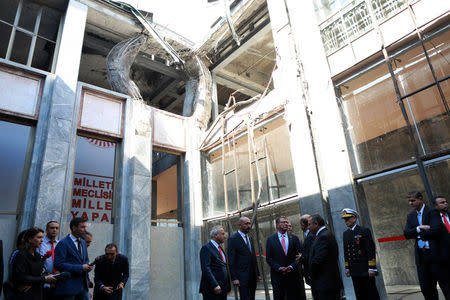 U.S. Defense Secretary Ash Carter, accompanied by Turkey's Defense Minister Fikri Isik, visits Turkish Parliament which was partly damaged during the July 15 coup attempt, in Ankara, Turkey, October 21, 2016. REUTERS/Adem Altan/Pool