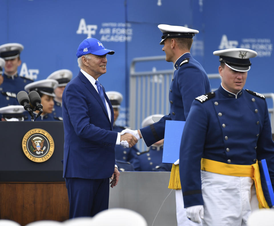 A cadet shakes hands with President Joe Biden after receiving his diploma during the United States Air Force Academy graduation ceremony, Thursday, June 1, 2023, at Air force Academy, Colo. (AP Photo/John Leyba)