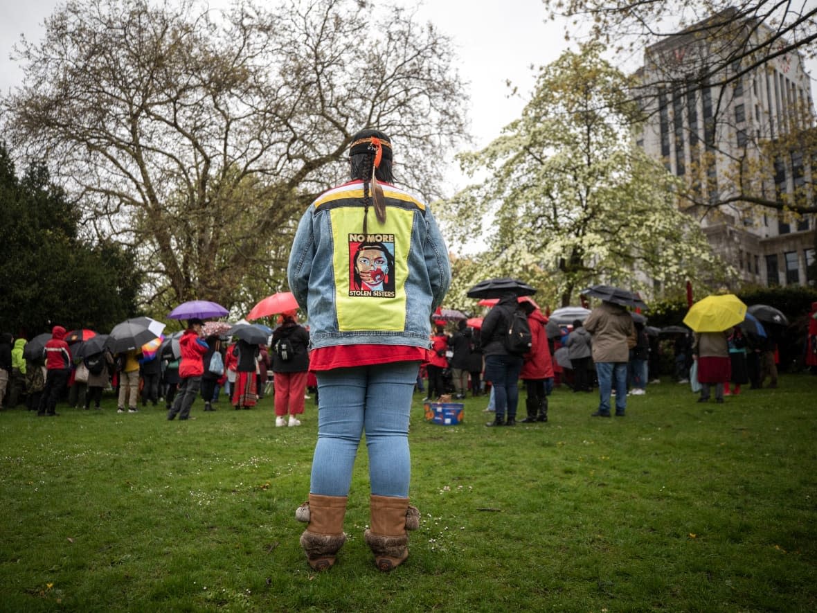 A memorial for Red Dress Day, raising awareness about missing and murdered Indigenous women and girls at City Hall in Vancouver on May 5, 2022. A national gathering held by the Assembly of First Nations wrapped up two days of meetings in Vancouver Thursday, with aims to outlining the next steps for action to end violence against Indigenous women and girls.   (Ben Nelms/CBC - image credit)