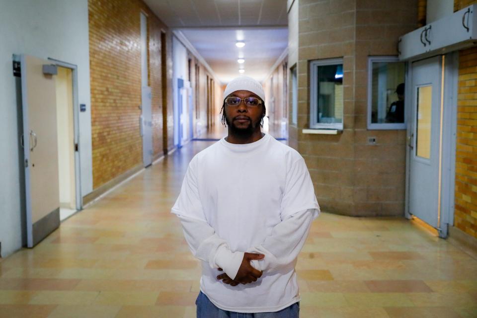 Myon Burrell, convicted in the murder of Tyesha Edwards, an 11-year-old girl pierced in the heart by a stray bullet in 2002 while doing homework at her family's dining room table, stands for a photograph at the Stillwater Correctional Facility, Wednesday, Oct. 23, 2019, in Stillwater, Minn. A growing number of legal experts, community leaders and civil rights activists are worried that the black teenager may have been wrongly convicted in the name of political expediency. (AP Photo/John Minchillo)