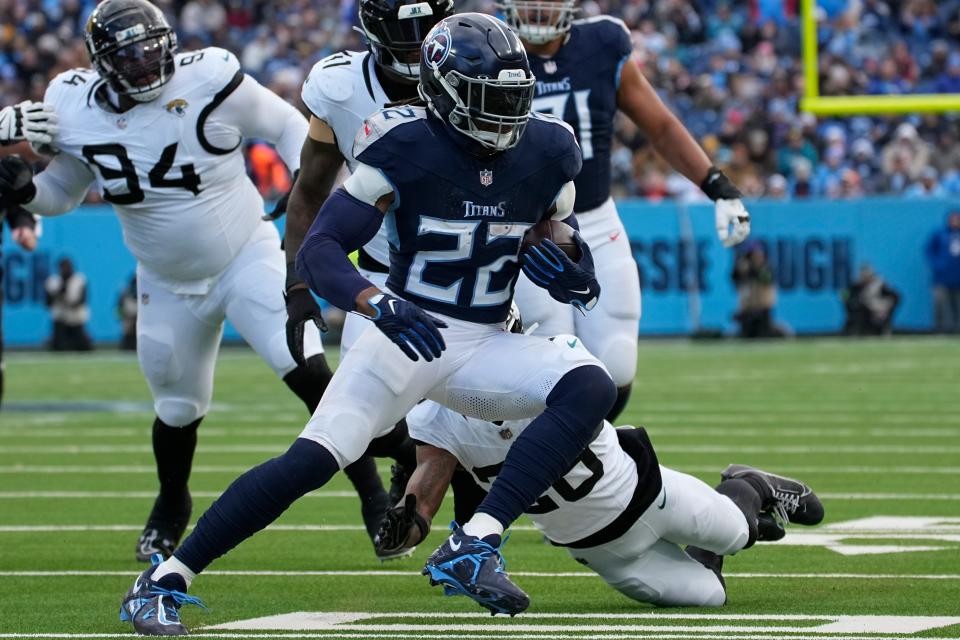 Tennessee Titans running back Derrick Henry (22) runs the ball during the first half of an NFL football game against the Jacksonville Jaguars. Sunday, Jan. 7, 2024, in Nashville, Tenn. (AP Photo/George Walker IV)