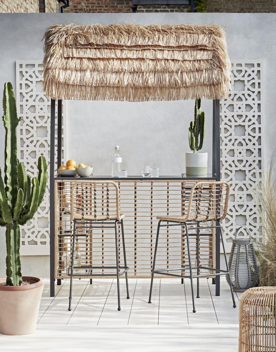 <p>Drinks, anyone? A seriously smart addition to any outdoor space, <a href="https://www.housebeautiful.com/uk/garden/a36185675/habitat-tiki-beach-bar/" rel="nofollow noopener" target="_blank" data-ylk="slk:garden bars;elm:context_link;itc:0;sec:content-canvas" class="link ">garden bars</a> are the ultimate way to turn heads this summer. If you don't have the space for a built-in bar, this pop-up alternative is the way to go. </p><p>Pictured: <a href="https://go.redirectingat.com?id=127X1599956&url=https%3A%2F%2Fwww.argos.co.uk%2Fproduct%2F9139941&sref=https%3A%2F%2Fwww.housebeautiful.com%2Fuk%2Fgarden%2Fg36276312%2Finstagrammable-garden%2F" rel="nofollow noopener" target="_blank" data-ylk="slk:Habitat Beach Bar Gazebo, £350 from Argos;elm:context_link;itc:0;sec:content-canvas" class="link ">Habitat Beach Bar Gazebo, £350 from Argos</a></p>