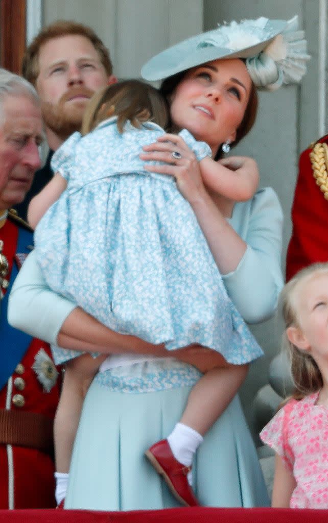 Catherine, Princess of Wales and Princess Charlotte of Wales stand on the balcony of Buckingham Palace during Trooping The Colour 2018 on June 9, 2018 in London, England.