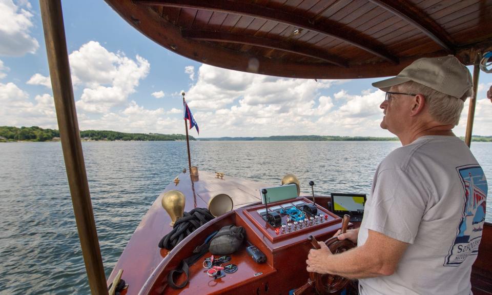 Captain Eric Wagner, of York, navigates the Chief Uncus north on the Susquehanna River at Long Level during its first run. Wagner is a licensed Master Captain and has operated boats in Baltimore and Annapolis. The century-old electric-powered boat will soon be operating tours on the river.