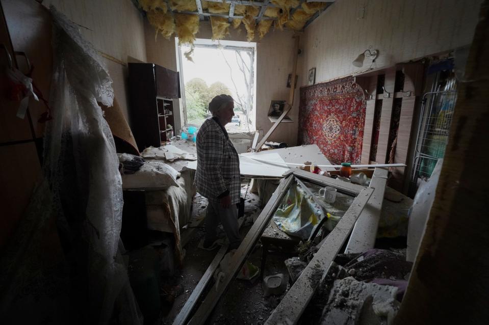 Irina Kuzkova, 83, stands in her flat at damaged building after latest Russian rocket attack in downtown Kharkiv, Ukraine, Monday, Sept. 12, 2022