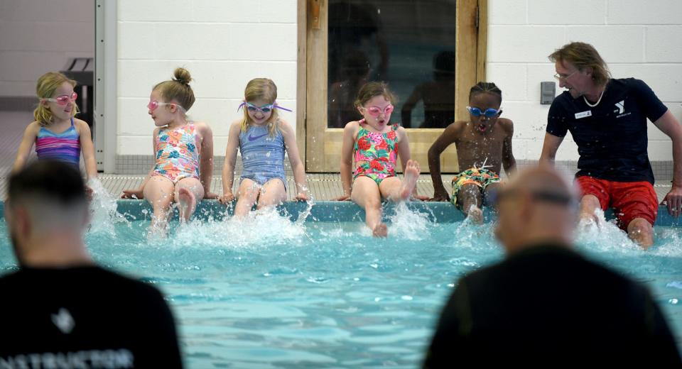 First grade students from Frazer Elementary School take swim lessons with instructor Jeff Miller at the Eric Snow Family YMCA in Canton as part of a partnership between the YMCA and Plain Local Schools.