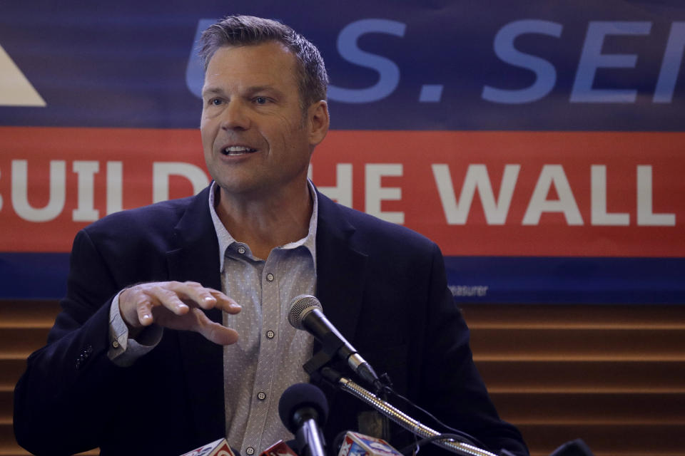 FILE _ in this Monday, July 8, 2019 file photo, former Kansas Secretary of State Kris Kobach addresses the crowd as he announces his candidacy for the Republican nomination for the U.S. Senate in Leavenworth, Kan. Even though U.S. Secretary of State Mike Pompeo has declared a Senate run to be "off the table" next year, many fellow Republicans in Washington and his home state of Kansas aren't buying it. (AP Photo/Charlie Riedel, File)