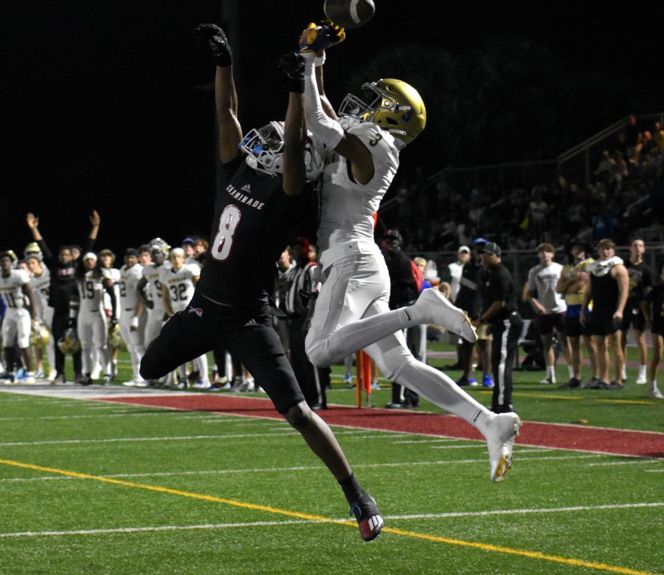 Cardinal Newman's Naeshaun Montgomery goes up for a pass in the end zone against coverage from Chaminade-Madonna on Nov. 24, 2023.