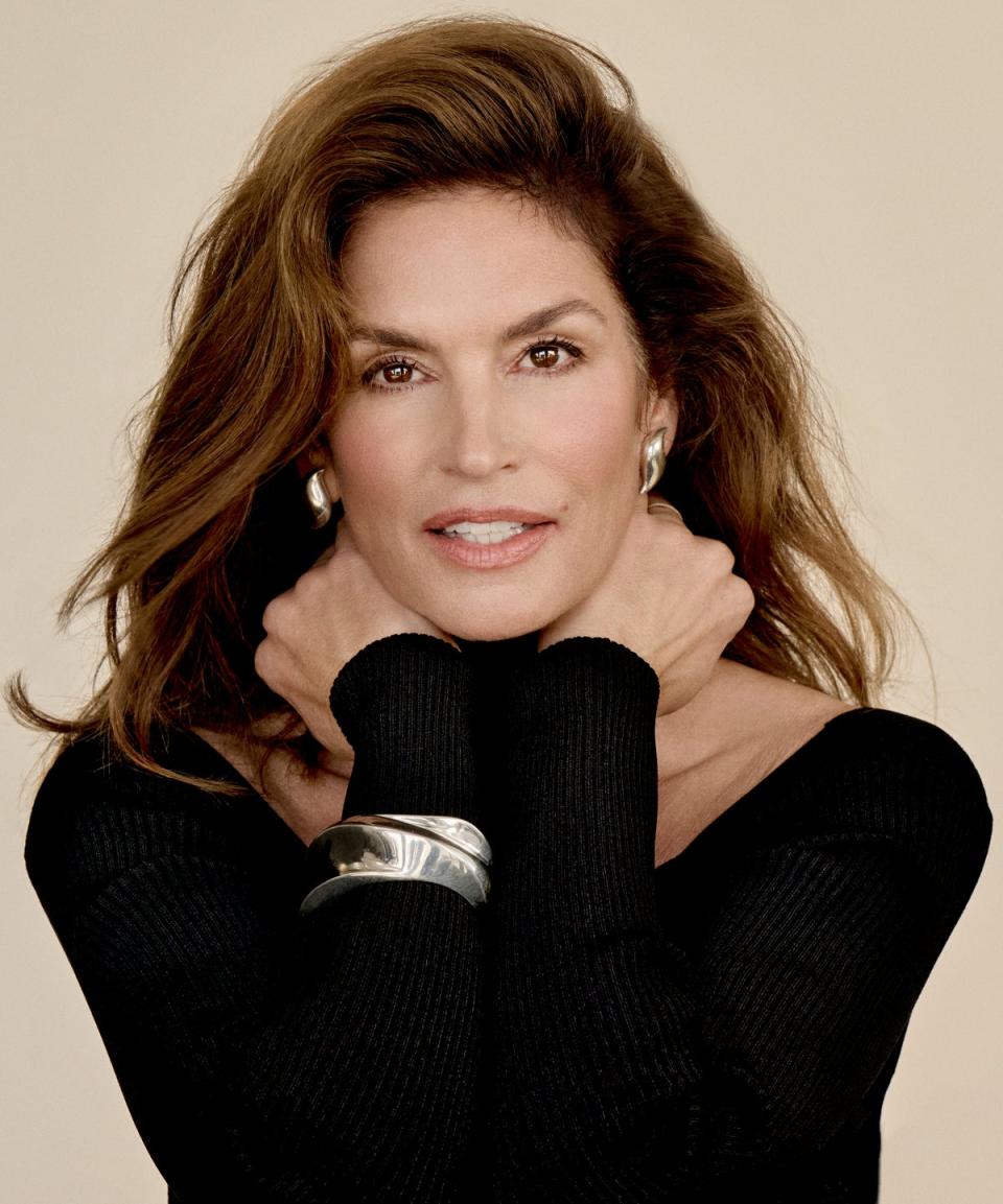 Cindy Crawford shot by Yu Tsai for ES Magazine. HOURGLASS COSMETICS Unlocked Instant Extensions Mascara, £30; Phantom Volumizing Glossy Balm in Sense 110, £35  (hourglasscosmetics.co.uk). ARMANI Luminous Silk Glow Blush in Euphoric, £45 (armanibeauty.co.uk) ALAÏA cut-out rib body, £1,050 (maison-alaia.com). SAINT LAURENT wavy cuff in metal, £1,035 (ysl.com). TIFFANY & CO Feather ear clips, £638 (tiffany.co.uk)