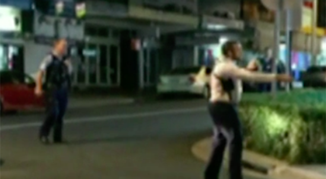 Footage shows police attempting to negotiate with the man to drop his weapon. Source: 7 News