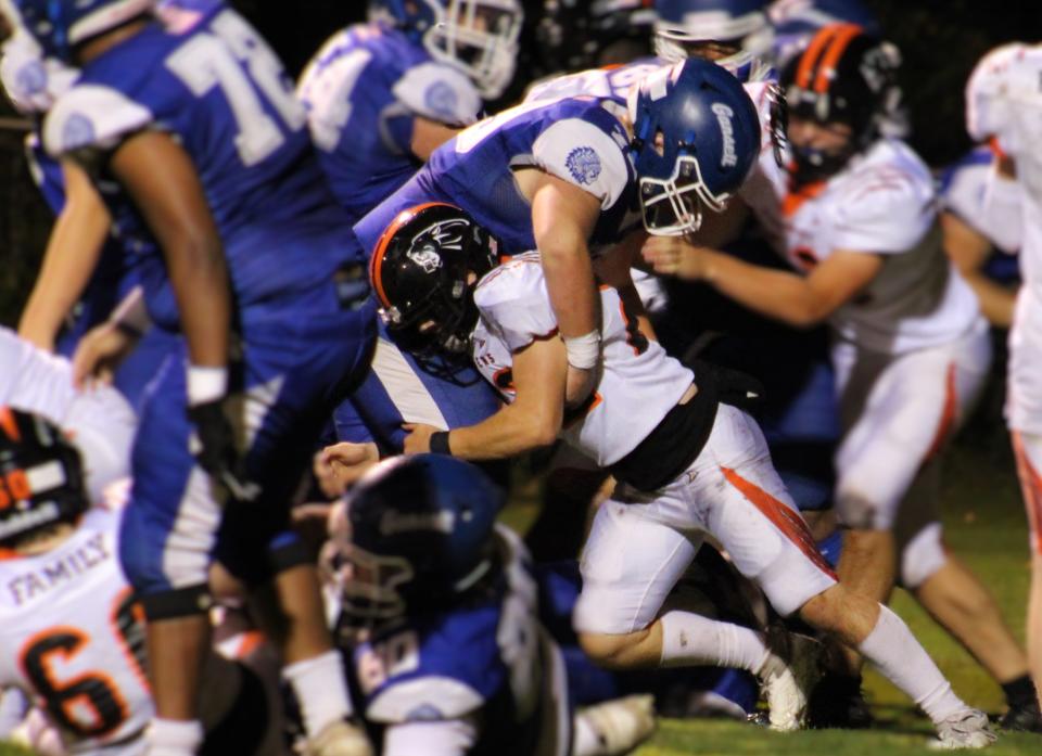 Narragansett's Justin Demarais blocks a David Prouty defender prior to a scoring play for the Warriors. 'Gansett defeated Prouty 41-8 on September 27, 2024.