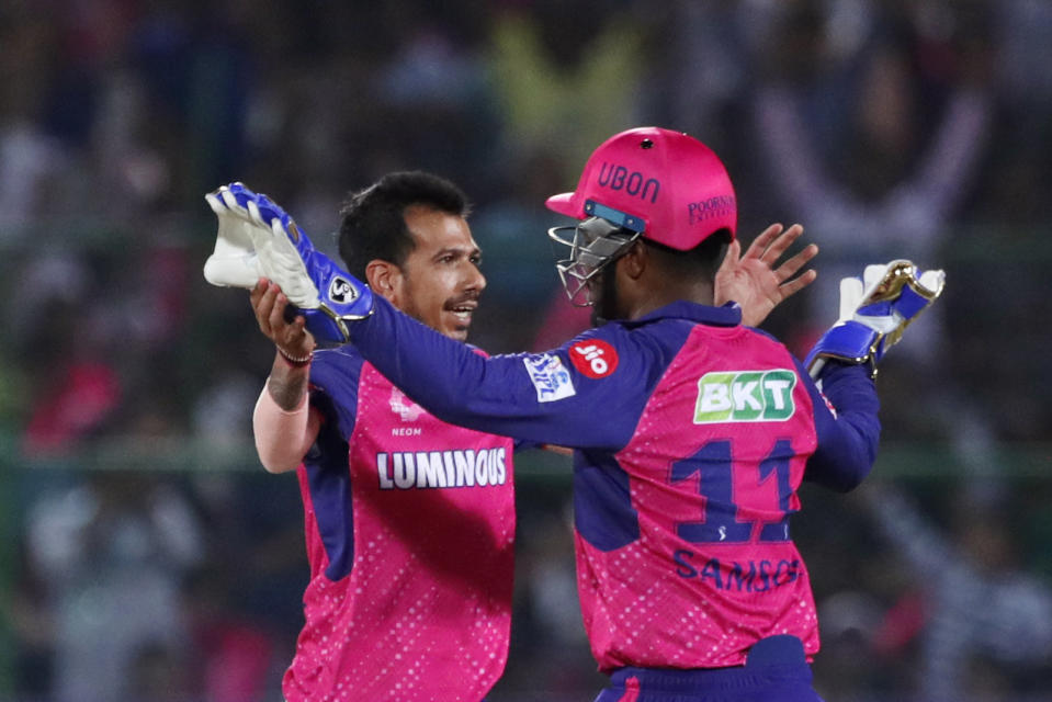 Rajasthan Royals' captain Sanju Samson, right, congratulates teammate Yuzvendra Chahal for taking the wicket of Delhi Capitals' captain Rishabh Pant during the Indian Premier League cricket match between Delhi Capitals and Rajasthan Royals in Jaipur, India, Thursday, March 28, 2024. (AP Photo/Pankaj Nangia)