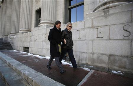 Kody Partridge (L) and her partner Laurie Wood walk from the Frank E. Moss federal courthouse in Salt Lake City, Utah in this December 4, 2013. The couple is challenging Utah's same-sex marriage ban. REUTERS/Jim Urquhart/Files