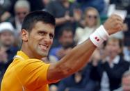 Novak Djokovic of Serbia reacts after defeating Rafael Nadal of Spain during their semi-final match at the Monte Carlo Masters in Monaco April 18, 2015. REUTERS/Jean-Paul Pelissier