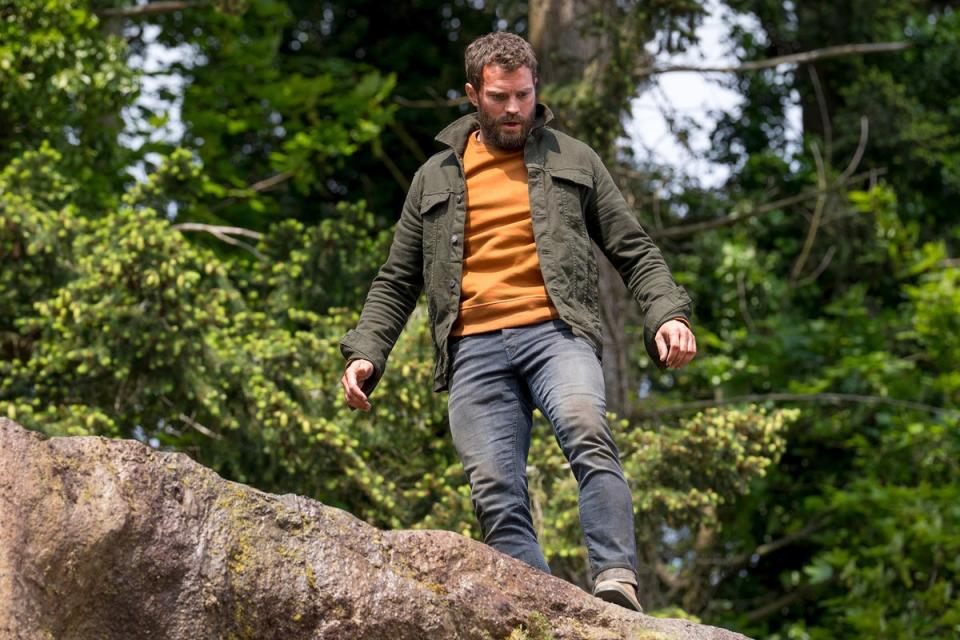 Man on the run: Dornan peers over a cliff edge in the second series of BBC One’s ‘The Tourist’ (BBC/Two Brothers/Steffan Hill)