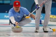 Curling - Pyeongchang 2018 Winter Olympics - Men's Round Robin - Britain v U.S. - Gangneung Curling Center - Gangneung, South Korea - February 21, 2018 - Matt Hamilton of the U.S. delivers a stone. REUTERS/Phil Noble