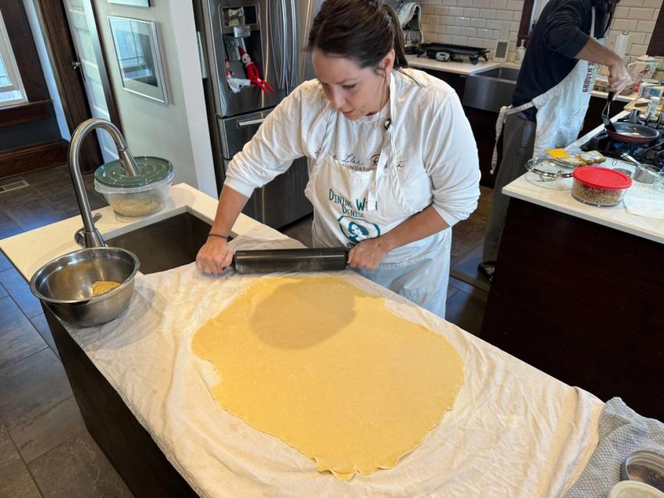 Katie Grover rolls out dough while making her grandmother’s recipe for Croatian povitica, something she does every Christmas for her family.