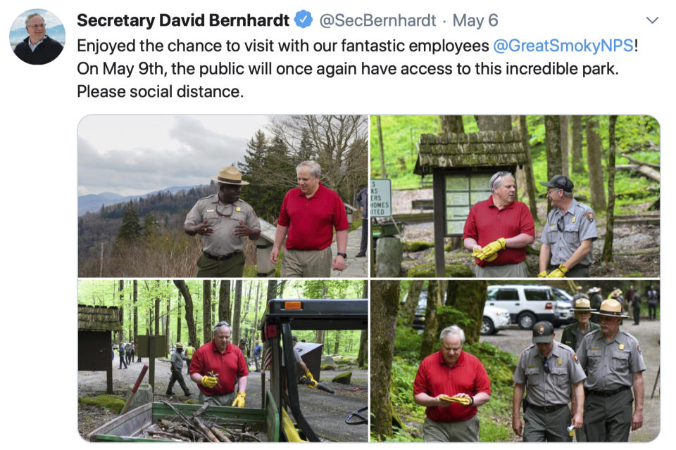 This Wednesday, May 6, 2020 tweet by Interior Secretary David Bernhardt shows images of the Interior Secretary visiting with National Parks Service employees at Great Smoky Mountains National Park. While the Interior Secretary asked visitors to social distance when the park reopens on May 9, neither Bernhardt nor park staff wore face masks in the photos, as they talked and walked inches apart during his visit on Tuesday, May 5. (National Parks Service via AP)