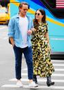 <p>Grant Hughes and Sophia Bush link arms during their walk through N.Y.C. on June 20. </p>