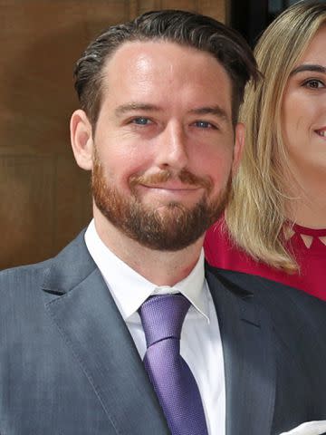 <p>Steve Parsons - WPA Pool/Getty</p> Barry Gibb's son Michael Gibb during an investiture ceremony at Buckingham Palace on June 26, 2018 in London, England.