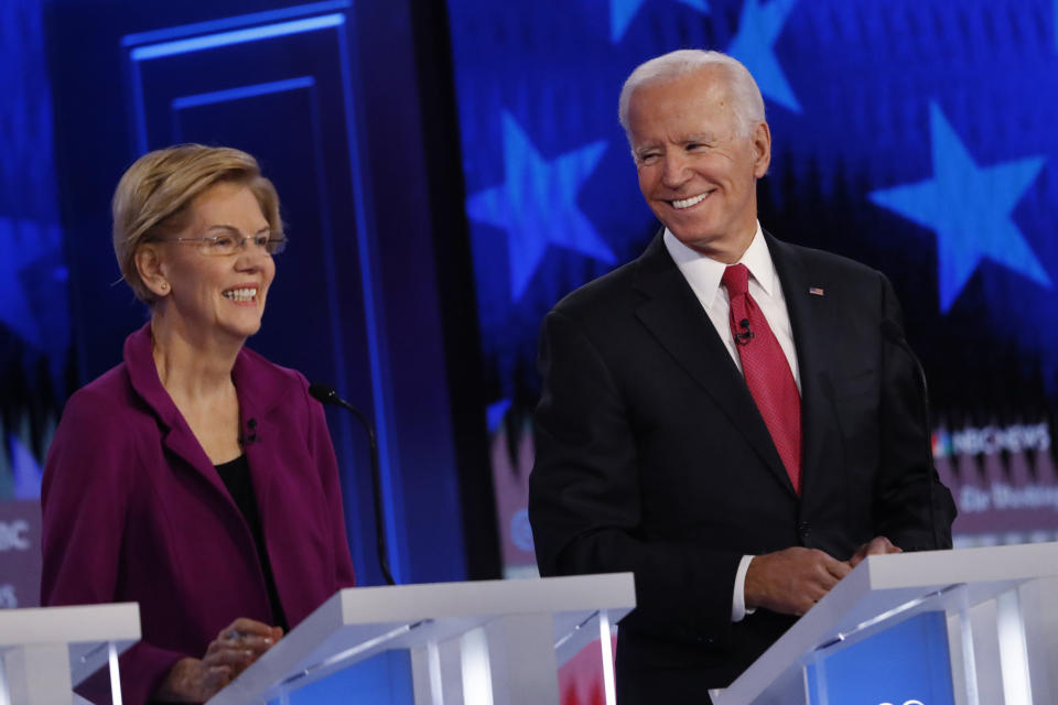 Democratic presidential candidate former Vice President Joe Biden speaks as Democratic presidential candidate Sen. Elizabeth Warren, D-Mass., listens during a Democratic presidential primary debate, Wednesday, Nov. 20, 2019, in Atlanta. (AP Photo/John Bazemore)