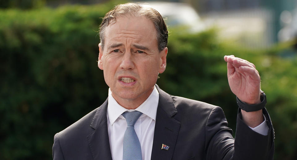 Australian Health Minister Greg Hunt speaks to the media during a press conference outside of the Mornington Medical Centre in Mornington, Sunday, April 19, 2020. Hunt announced the Australian Government has secured more than three million additional doses of seasonal influenza vaccines and the arrival of 58 million protective face masks that will help provide essential protection for frontline health workers at risk of COVID-19. (AAP Image/Scott Barbour) NO ARCHIVING