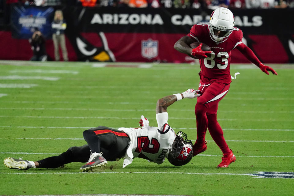 Arizona Cardinals wide receiver Greg Dortch (83) is hit by Tampa Bay Buccaneers cornerback Carlton Davis III during the second half of an NFL football game, Sunday, Dec. 25, 2022, in Glendale, Ariz. (AP Photo/Darryl Webb)