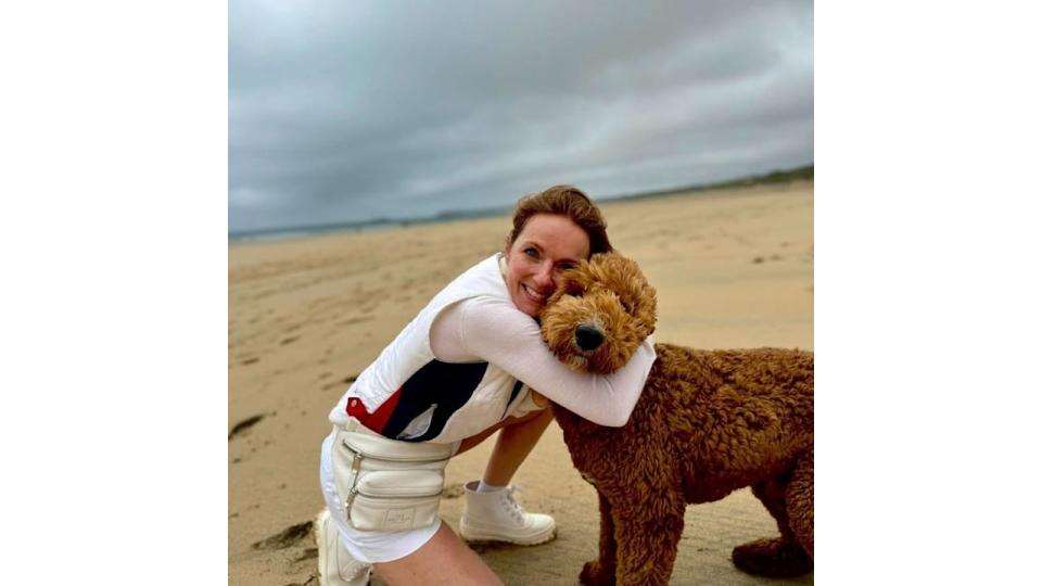 Geri Halliwell Horner hugging pet dog