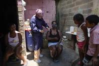 Nurse Rosaura Rodriguez inoculates a woman with a dose of the Sinopharm COVID-19 vaccine during house to house vaccinations in the popular neighborhood of El Valle in Caracas, Venezuela, Monday, Sept. 27, 2021. According to the Pan American Health Organization Venezuela one of the least vaccinated countries in the continent, is seeing a growing uptick in caseloads, unlike other countries in the region where cases are dropping. (AP Photo/Ariana Cubillos)