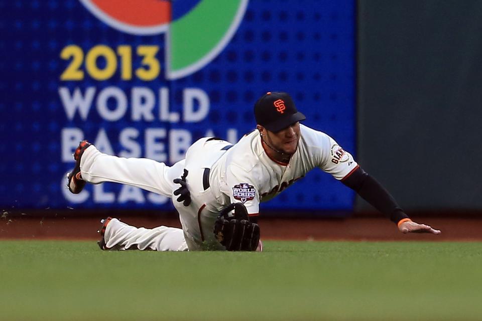 SAN FRANCISCO, CA - OCTOBER 24: Gregor Blanco #7 of the San Francisco Giants makes a diving catch in left field in the third inning during Game One of the Major League Baseball World Series at AT&T Park on October 24, 2012 in San Francisco, California. (Photo by Doug Pensinger/Getty Images)